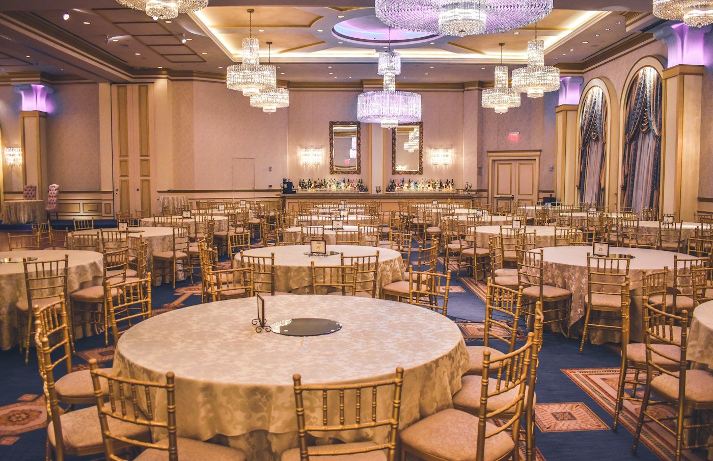 Elegant reception space with tables and chandeliers